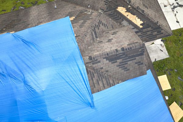 Storm Damage Roof Tarping in Torrington